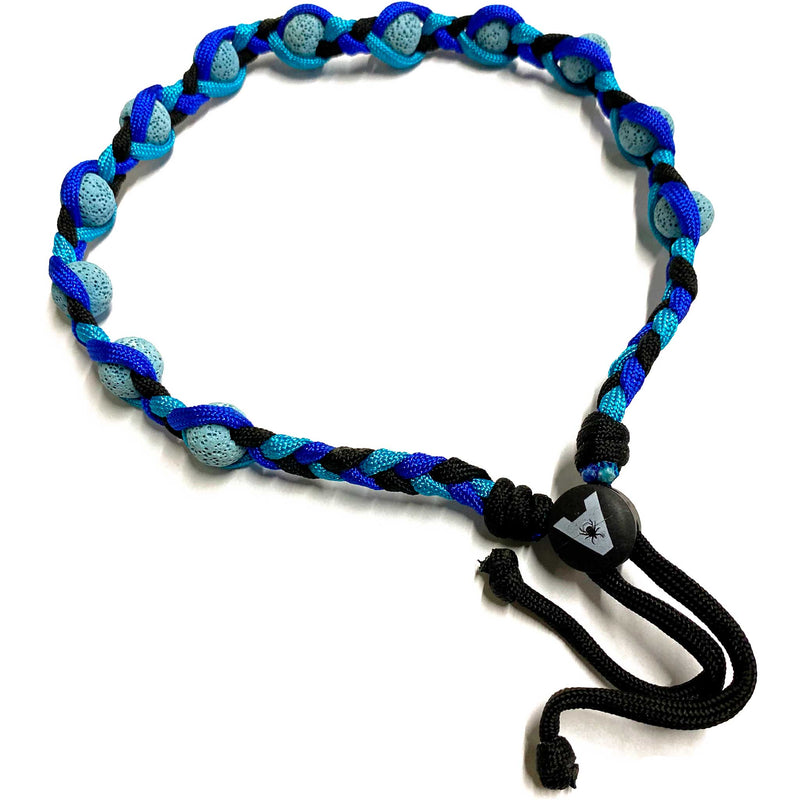 A durable, adjustable lava bead collar in blue and black, designed to absorb Tick Attack™ repellent for long-lasting protection. Can be used as a dog collar or hair band.