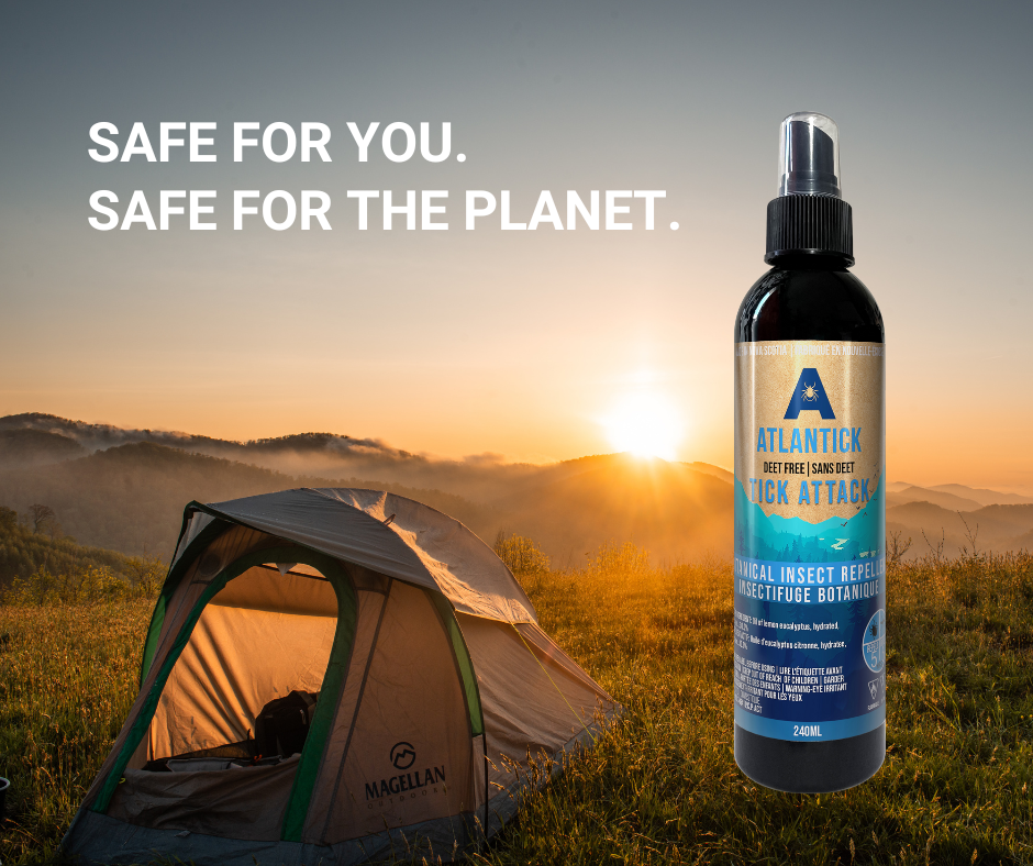 A scenic outdoor camping setup featuring a tent with a beautiful sunset in the background, with a Tick Attack™ 240ml bottle in the foreground. Highlights the perfect tick protection for campers, hikers, and outdoor adventurers.